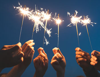 Hands holding sparklers